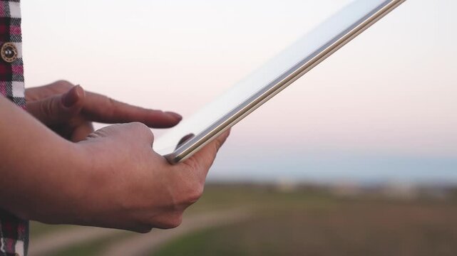 Agribusiness technology in the field ipad agricultural control precision agriculture Farmer ipad in cultivated soybean field, applying modern technology in agricultural activity, selective focus.