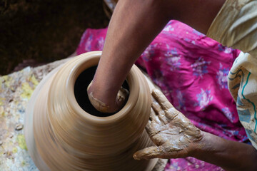 hands of a potter at work