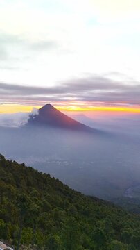Vertical drone view of Agua Volcano at sunset, Guatemala	
