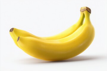 A close up studio shot of two ripe yellow bananas lying side by side on a white background surface