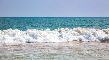 The ocean is calm and the waves are small