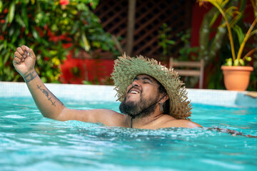 Local Costa Rican tourist enjoying a dip in the pool in Tortuguero, Costa Rica
