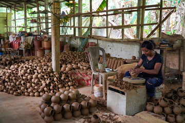 women making clay pots
