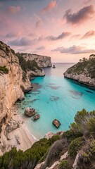 Fototapeta premium Serene coastal cove with turquoise waters and dramatic cliffs bathed in soft sunset light