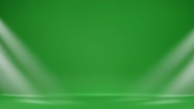 Green screen studio backdrop with two spotlights shining down from above on a simple stage area