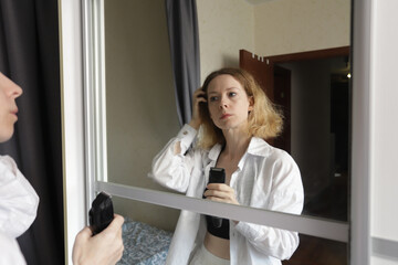 Cancer Patient Taking Control, Woman Preparing to Shave Her Head Before Hair Loss Begins