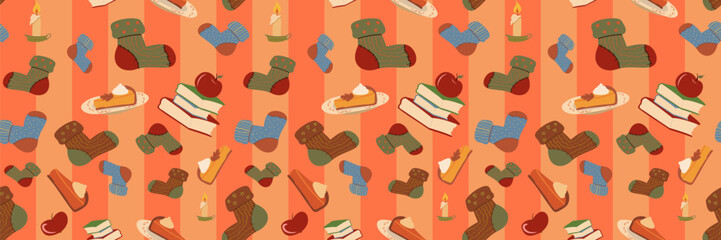 Seamless bright cartoon pattern of cozy autumn elements: socks, pumpkin pie, apples, books, and candles on a striped orange background. Ideal for fall textiles and seasonal home decor.