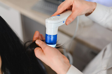 Microscopic examination of the hair and skin of the scalp