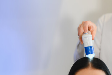 Microscopic examination of the hair and skin of the scalp