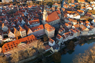 Obraz premium Aerial drone view of the main church (Stiftskirche) and the historic old town of Tübingen in Southern Germany