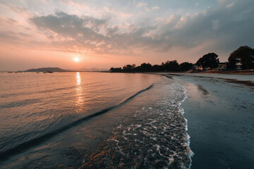 breathtaking sunset over bay of bengal in india with warm hues of orange and pink reflecting on calm waters