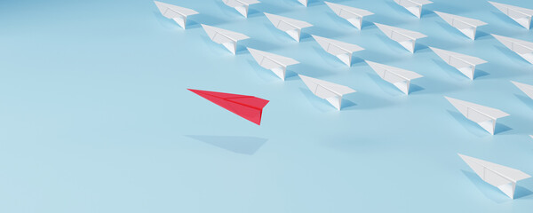 Red paper plane flying in different direction from white planes on blue background. Concept of leadership, innovation, thinking differently, and standing out.