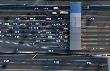 A highway where cars are paying tolls.