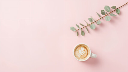 Coffee cup with latte art and eucalyptus branch white