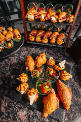 Chopstick table, delicious snacks with cheese and salami. Vertical shot of a reception at an expensive restaurant. 