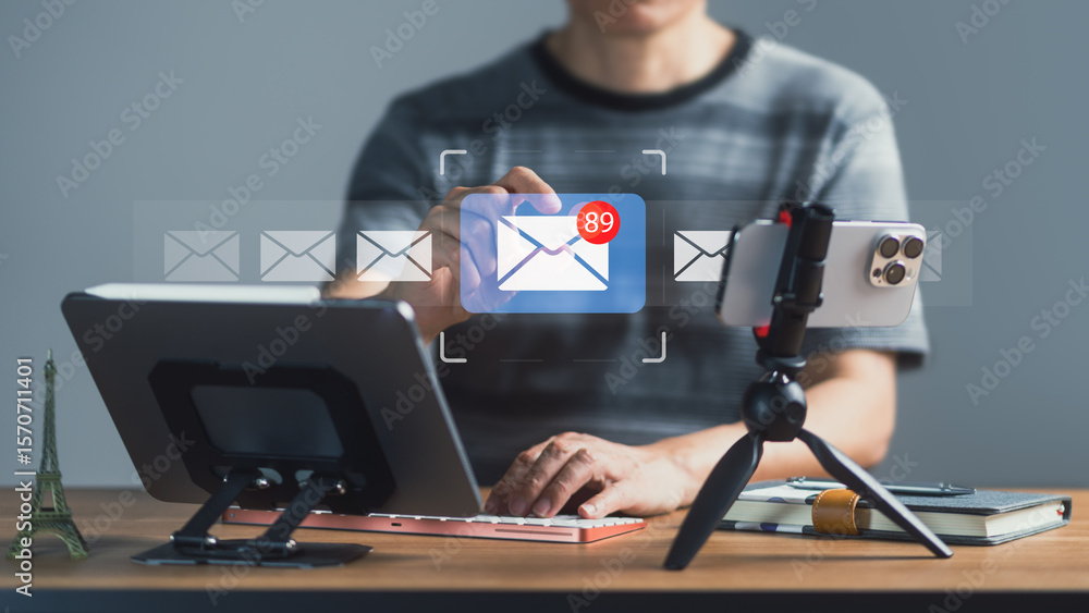 Poster man receiving new email notification with digital tablet and smartphone