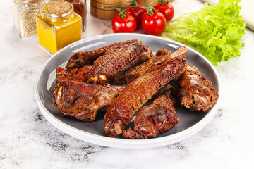 Roasted duck wings with sauce