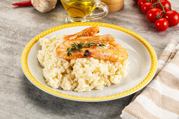 Italian risotto with prawn served thyme