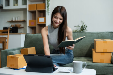 Woman start up online seller owner at workplace. small business entrepreneur SME or freelance asian...