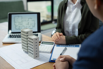 Real estate broker agent presenting and consult to customer to decision making sign insurance form...