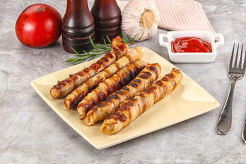 Grilled meat sausages wrapped bacon