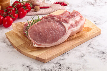 Raw potk loin steak with bone