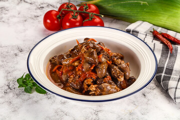 Baked chicken hearts with vegetables