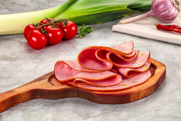 Mortadella pork sausages slices heap