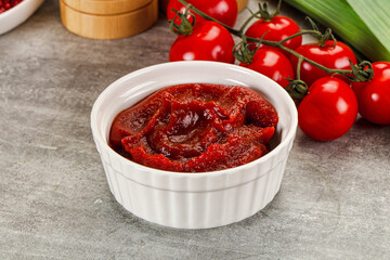 Red tomato paste in the bowl