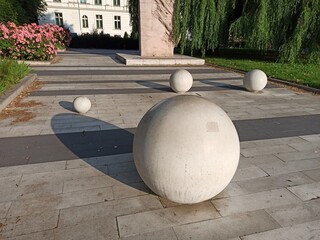 Spheres representing Solar system. Monument to medieval researcher.