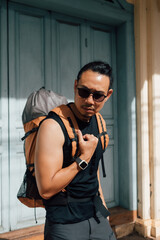 Tourist backpacker man traveling in Asia old town.