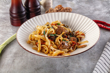 Asian cuisine udon with chicken and vegetables