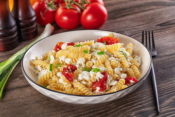 Italian pasta fusili with curd
