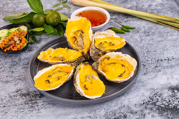 Baked oyster with cheddar cheese