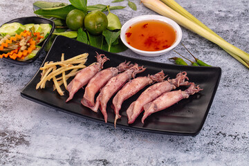 Boiled wild mini calamari snack