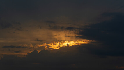Dark sky and orange cloud at sunset.