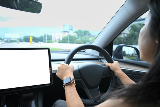 Interior view of electric vehicle with blank dashboard display screen ideal for app interface design