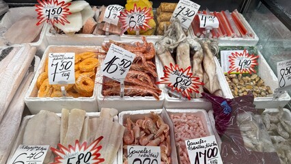 Frozen seafood assortment at local market in Daugavpils, Latvia, July 6, 2025. Display includes...