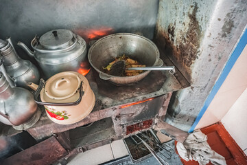 Cooking food on a traditional stove in the house of the Pamir population of the Pamirs in the village of Karakul