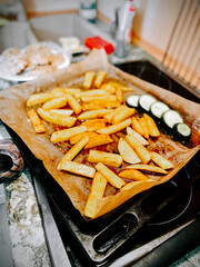 Crispy homemade fries and zucchini ready for serving in a cozy kitchen setting