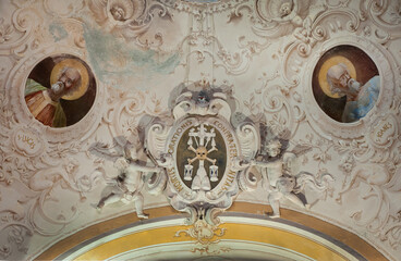 Baroque interior of the church with rich symbolic decor, fresco, of sculptures of skeletons and...