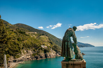 calm bay view with bronze sculpture of monk, Monterosso al Mare, Cinque Terre