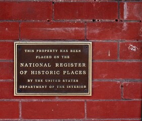 US Department of Interior plaque on a red brick wall