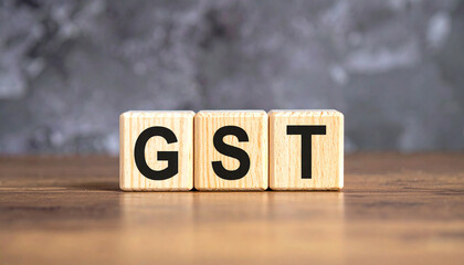 Wood blocks with abbreviation text GST - Goods and services tax.