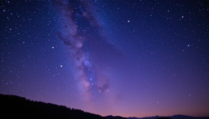 Fototapeta premium a serene night sky wallpaper featuring a blue night sky filled with sparkling stars, perfect for your phones background or a stunning desktop wallpaper