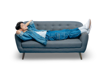  Asian man relaxes completely, lying down on a sofa with his hands behind his head and a peaceful smile , PNG