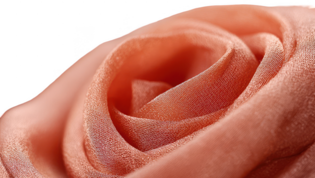 Close-up of a peach-colored fabric rose