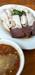 Picture of boiled chicken with dipping sauce