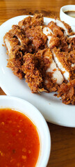 Picture of fried chicken with dipping sauce