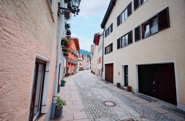 Charming European Village Street With Colorful Buildings and Cobblestone Path